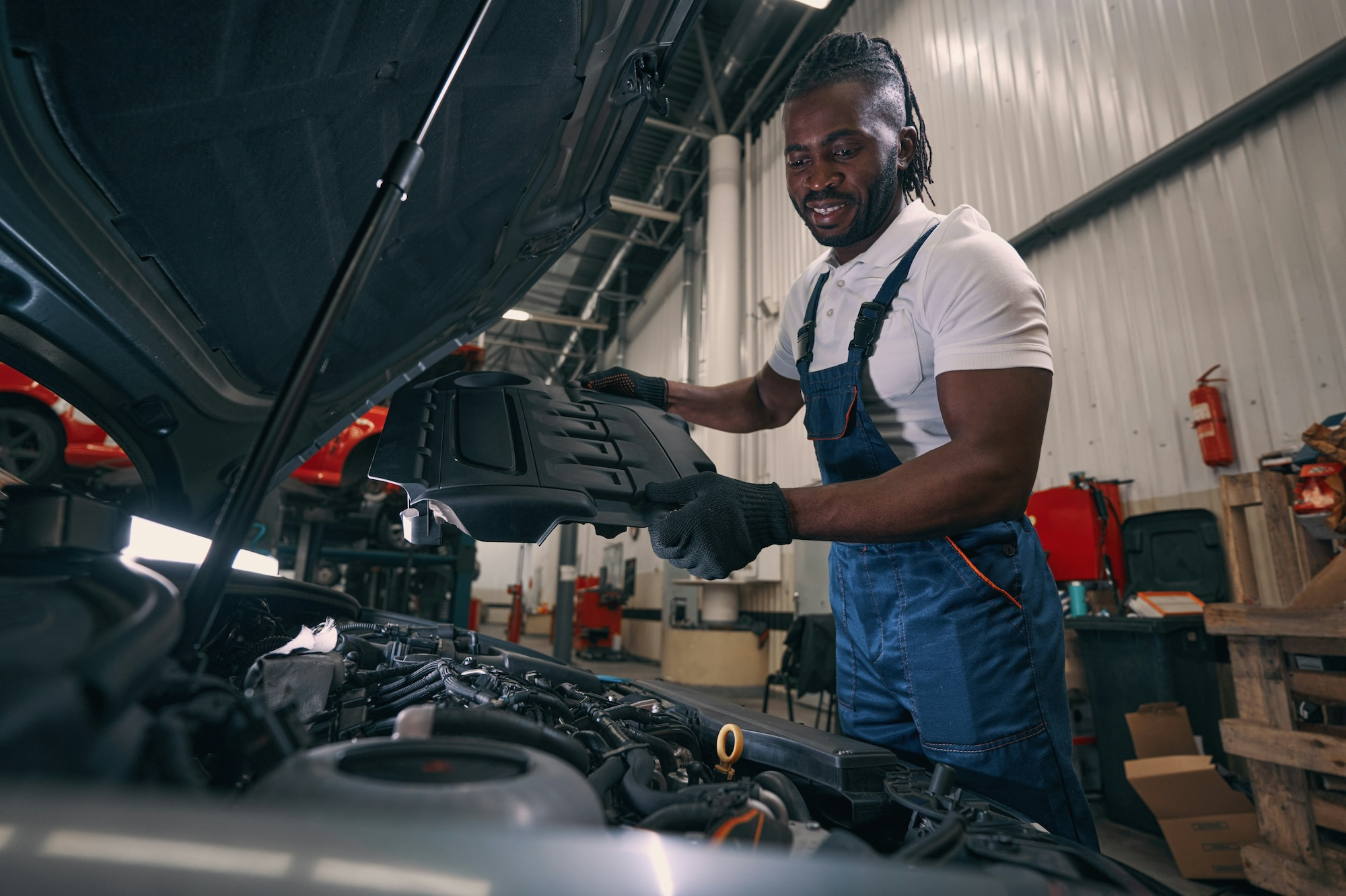 this is a picture of a man next to a car